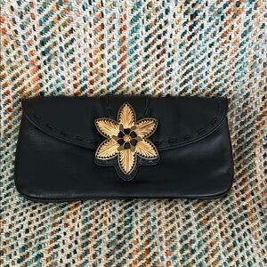 Elegant Black Leather Clutch with Floral Accent